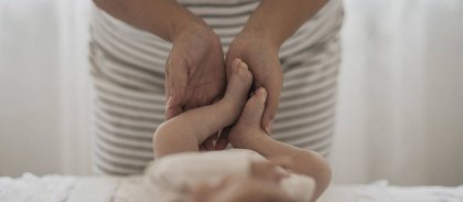 mother-hands-playing-with-baby-legs-site.jpg -